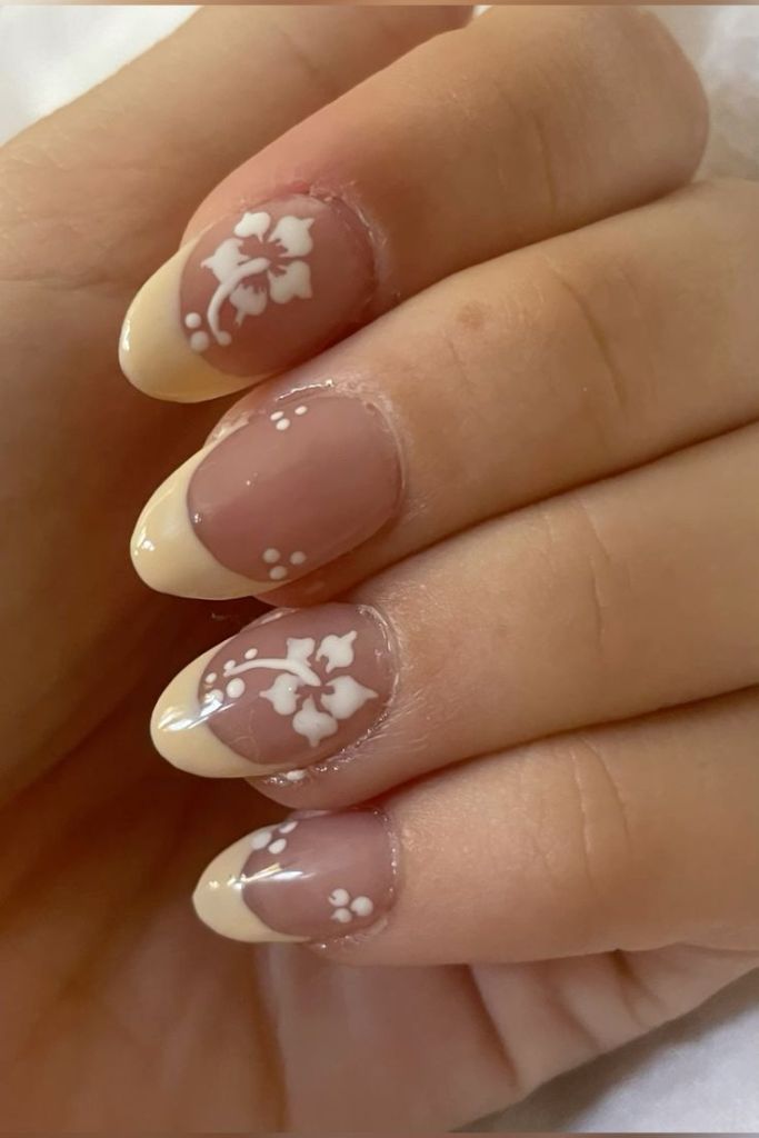 Yellow French Tip Nails with Hawaiian Flower Design
