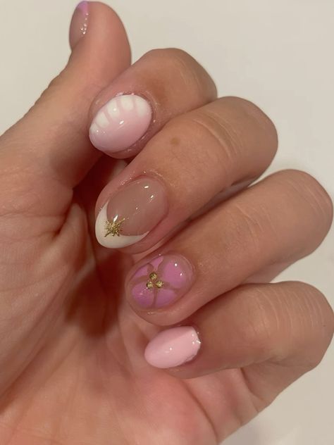 Pink blooming gel summer nails with golden chrome accents