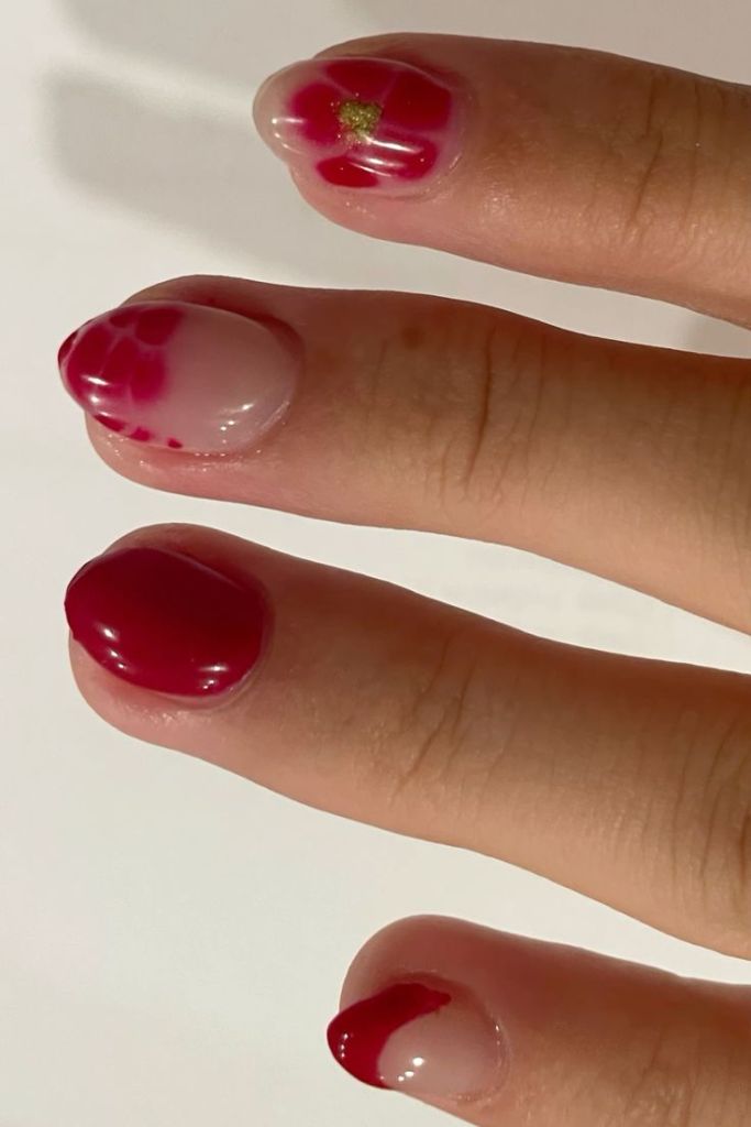 Red blooming gel nails with a gradient effect